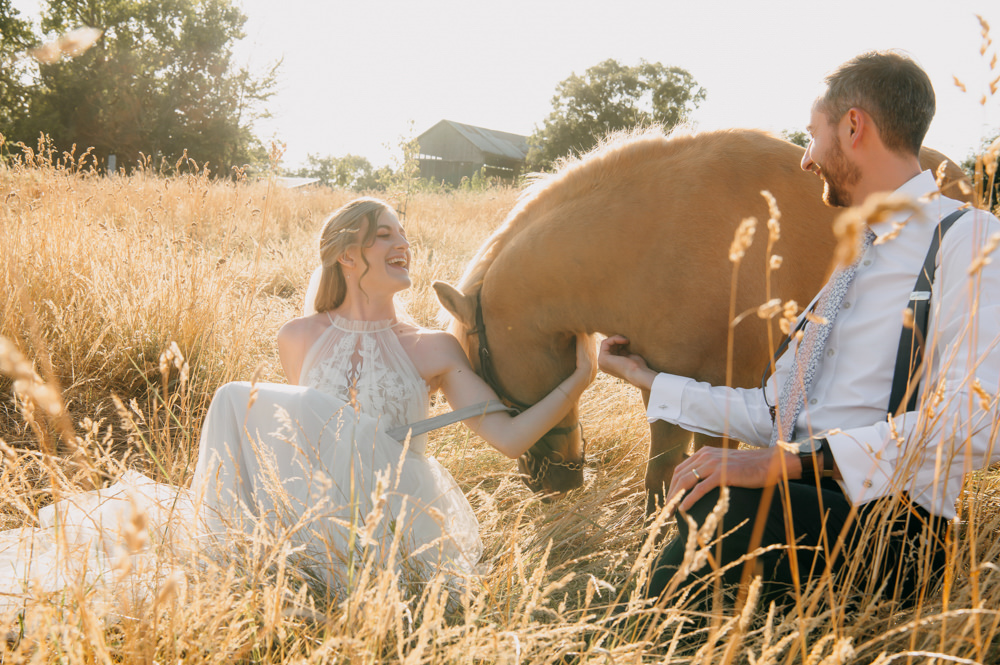 oxleaze barn wedding photographer, couple with pony 