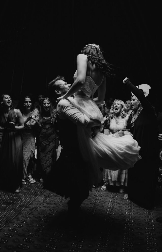 black and white image of bride and groom during first dance