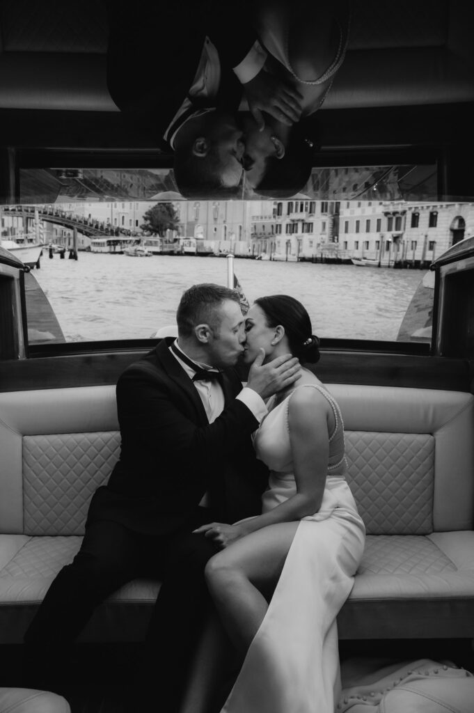 bride and groom on a boat in venice